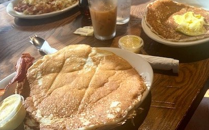 Sporty's colossal pancakes the size of a plate.
