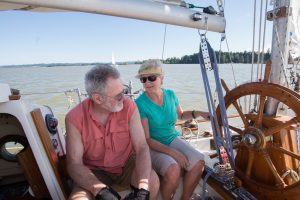 A couple sailing in Puget Sound off of Vashon exhibiting Vashon's unique culture.
