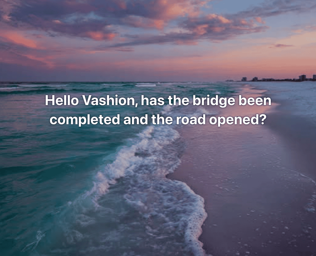 Sunset beach with pink clouds and teal water, overlaid with the headline: 'Hello Vashion, has the bridge been completed and the road opened?'